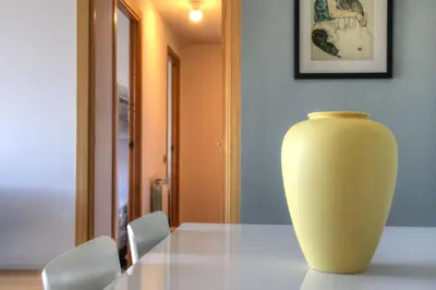 a yellow vase sitting on top of a table at Barcelona Olympic Apartment in Barcelona