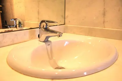 a sink with a faucet in a bathroom at Barcelona Olympic Apartment in Barcelona
