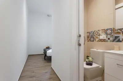 a bathroom with a toilet and a sink at Matarolux 7 in Mataró