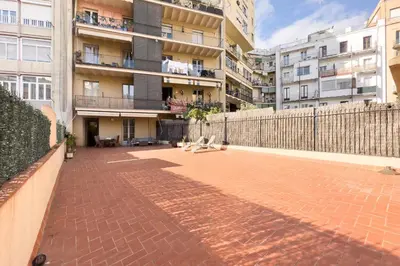 a brick walkway in front of a building at ApartEasy - Passeig de Gracia in Barcelona