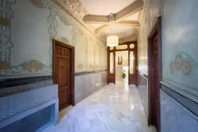a hallway of a building with a room with a hallway at ApartEasy - Passeig de Gracia in Barcelona