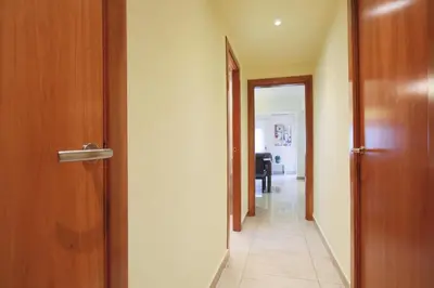 an open door with a hallway leading to a room at ApartEasy - Family Apartment Sant Antoni in Barcelona