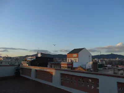 a view of a city from the roof of a building at Feel at Sants Apartments in Barcelona