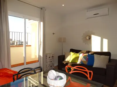a living room with a couch and a glass table at Feel at Sants Apartments in Barcelona