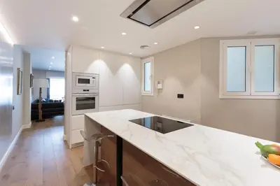 a kitchen with white walls and a counter top at RAMBLA POBLENOU Luxury in Barcelona