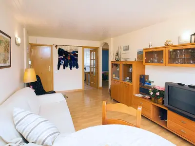 a living room with a white couch and a tv at Apartment Mariola by Interhome in Sant Andreu de Llavaneres