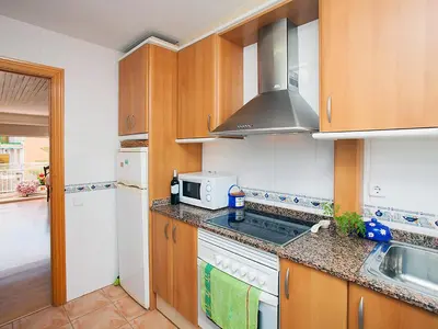 a kitchen with a stove top oven next to a sink at Apartment Mariola by Interhome in Sant Andreu de Llavaneres