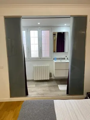 an open door in a room with a kitchen at Channing Apartment in Barcelona