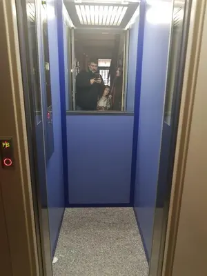 a man and a woman standing in a blue door at Penthouse in Sagrada Familia in Barcelona