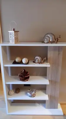 a white shelf with seashells and other items on it at Helena Seaview & Beach-apartment in Montgat