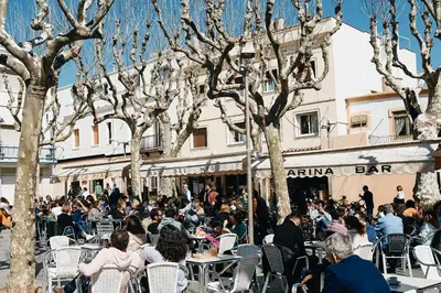 a crowd of people sitting at tables outside a building at CAL PADRI1871 - 30min to Barcelona, Groups & Families, Beach Stylish House in Premiá de Mar