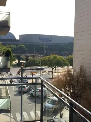 a view of a parking lot with cars parked at Apartamento FIRA Barcelona in Hospitalet de Llobregat