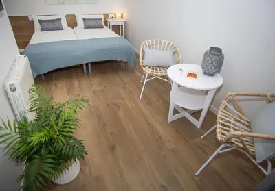 a bedroom with a bed and a table and chairs at Mai & Maud Ronda Apartment in Barcelona