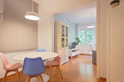 a dining room with a table and chairs at Alcam Paseo San Juan in Barcelona