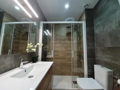 a bathroom with a shower and a sink and a toilet at Apartment Beach Front Sant Pol in San Pol de Mar