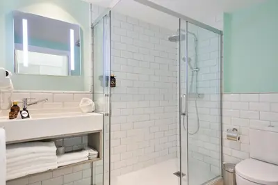 a bathroom with a shower and a sink at Niu Barcelona Hotel in Barcelona
