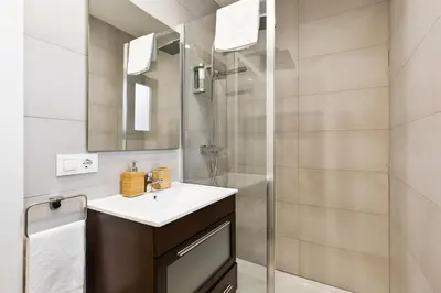 a bathroom with a sink and a shower at Modern Catalan Apartments by Olala Homes in Hospitalet de Llobregat