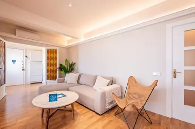 a living room with a couch and a table at Sweett - Atic Eloi in Barcelona