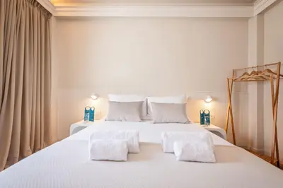 a bedroom with a large white bed with two white pillows at Sweett - Atic Eloi in Barcelona