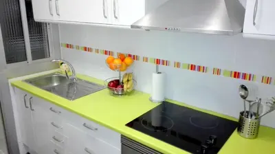 a small kitchen with a sink and a counter at Cosmo Grey in Hospitalet de Llobregat