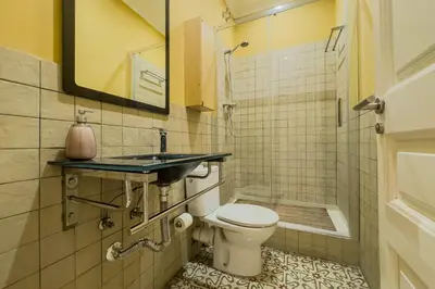a bathroom with a toilet and a sink at Novus Homes Barcelona Eixample in Barcelona