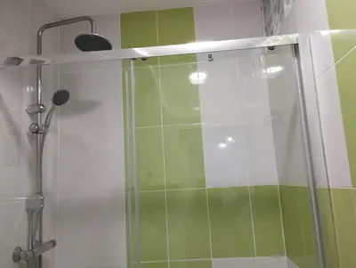 a shower with a glass door in a bathroom at Apartment Fira Bcn Camp Nou in Hospitalet de Llobregat