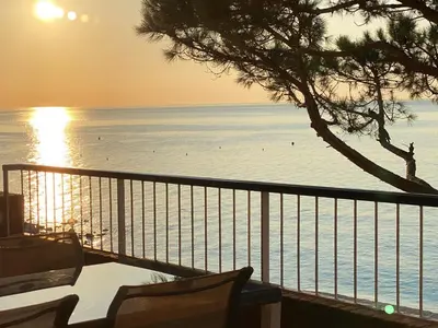 a view of the ocean from a balcony of a resort at Musclera in Arenys de Mar