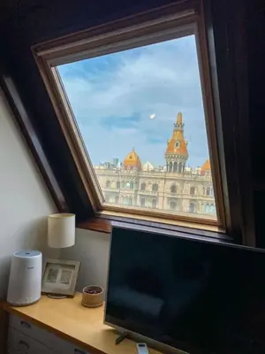 a window with a view of a large building at Passeig de Gracia Studio Loft in Barcelona