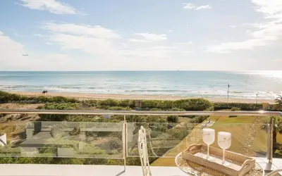 a view of the beach from the balcony of a house at Gava Beach 1st Line in Gavà