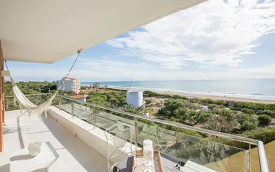 a balcony with a view of the beach at Gava Beach 1st Line in Gavà