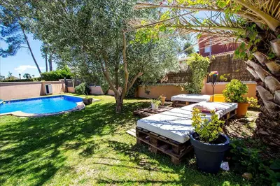 a backyard with a swimming pool and a patio with a mattress at Catalunya Casas Modern and spacious with private pool close to BCN in Senmanat