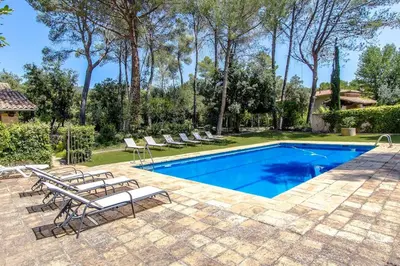 a swimming pool with lounge chairs next to a house at Catalunya Casas Heavenly Haven for 16 pax , 30km from Barcelona! in Castellar