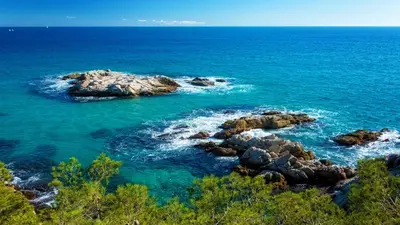 a view of the ocean with rocks in the water at Catalunya Casas Heavenly Haven for 16 pax , 30km from Barcelona! in Castellar