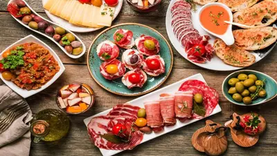 a table with many plates of food on it at Catalunya Casas Heavenly Haven for 16 pax , 30km from Barcelona! in Castellar