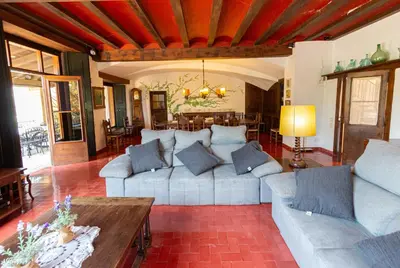 a living room with a couch and a table at Catalunya Casas Heavenly Haven for 16 pax , 30km from Barcelona! in Castellar