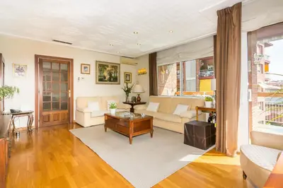 a living room with a couch and a table at HomeHolidaysRentals Amaral in Pineda de Mar