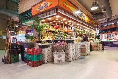 a store with a bunch of fruits and vegetables at Apartamentos Cornellalux 2 in Cornellà de Llobregat