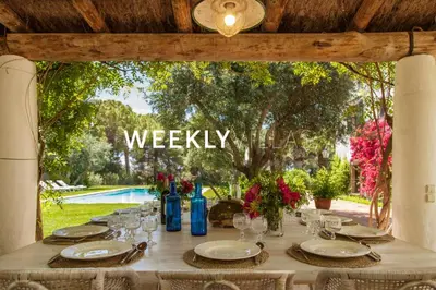a table set up for a meal in a gazebo at Masia Sitges Mas Peirot Geniune Farmhouse 20 min walk from beaches 60 Heactares of Wine Fields Garden AC Until 18 people in Cubelles