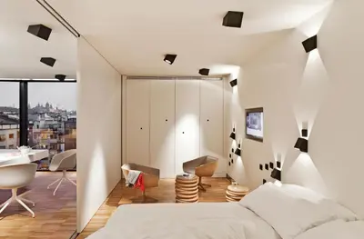 a bedroom with white walls and a bed and a desk at DestinationBCN Urgell Apartment in Barcelona