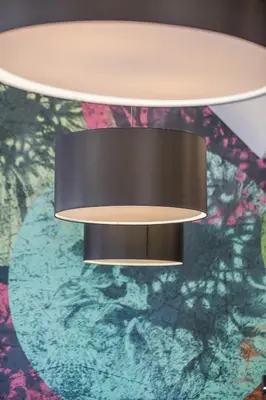a light hanging from a ceiling in a room at Hotel Venture Sant Cugat in Sant Cugat del Vallès