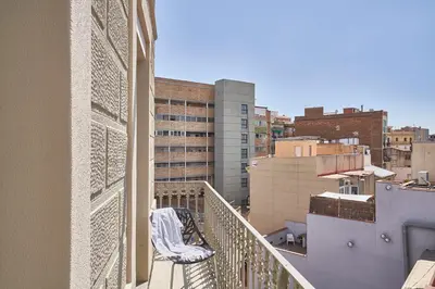 a balcony with a view of a city at Barcelona Sants Station Apartments in Barcelona