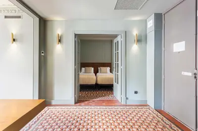 a hallway with two beds in a hotel room at Unique Rentals - Luxurious Oasis in Barcelona