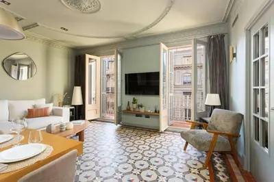 a living room with a couch and a tv at Unique Rentals - Luxurious Oasis in Barcelona