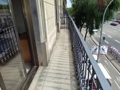 a stairway leading up to a building on a street at Hostal Nuevo Colon in Barcelona