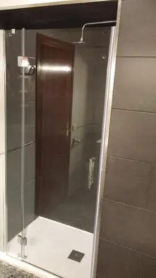 a shower with a glass door in a bathroom at LG Big Flat Barcelona in Badalona