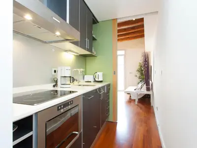 a kitchen with a sink and a stove at Barcelona Igualada Apartment in Barcelona