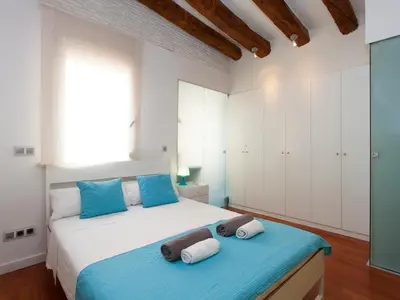 a bedroom with a bed with towels on it at Barcelona Igualada Apartment in Barcelona