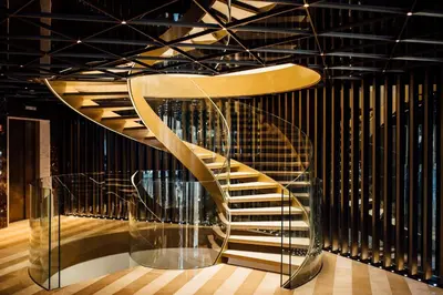 a staircase in a room with a glass case at Almanac Barcelona in Barcelona