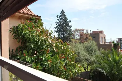 a view of a tree from a balcony at Tibidabo Apartments in Barcelona