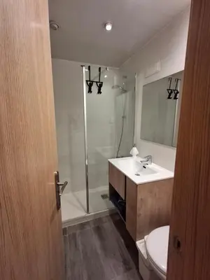a bathroom with a shower and a sink and a toilet at Candela's Beach Port in Masnou